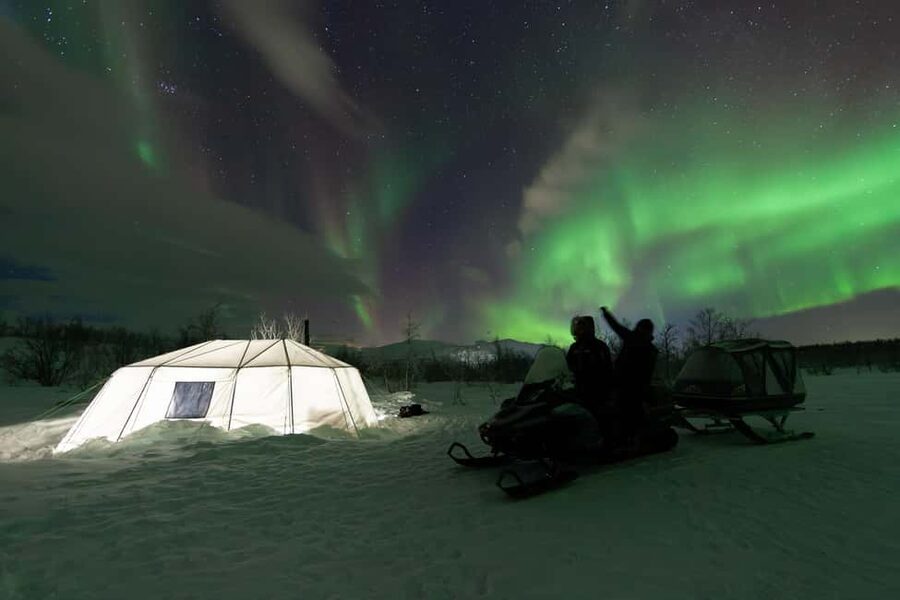 Aurora Snowmobile Sled Tour - The snowmobile-drawn sled ride: slow, cozy, and built for winter comfort