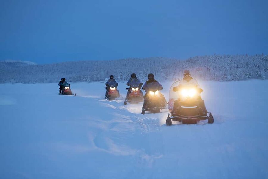 Kiruna: Guided Snowmobile Tour with Lunch - Torne River Valley snowmobile time, with a guide doing the heavy lifting