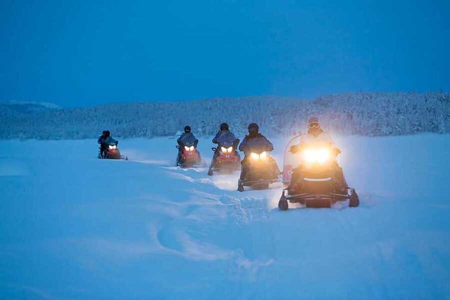 Kiruna: Northern Lights Snowmobile Tour with Dinner - Kiruna at Night, with a Real Arctic Circle Goal