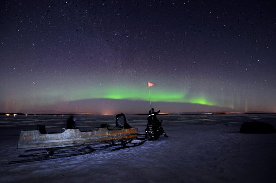 Luleå : Northern Lights Tour on a Snowmobile drawn Sled - Snowmobile-drawn sled comfort: reindeer pelts, blankets, and staying warm