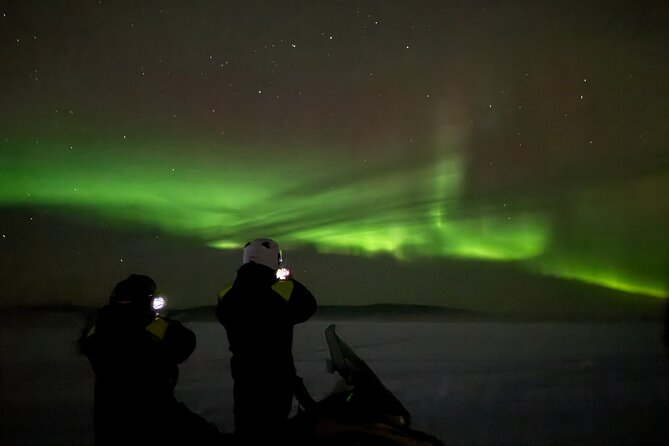 Northern Light Snowmobile Tour in Kiruna - Shared snowmobile setup: driver, passenger, and switching