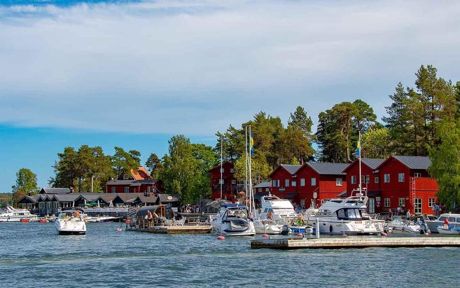 Red timber cottages on an island in the Stockholm archipelago