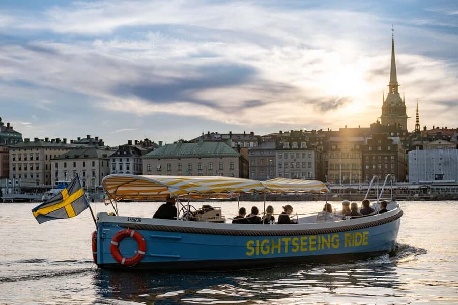 Stockholm: Guided City Sightseeing Open Electric Boat Tour - Djurgården Canal views and the spires you catch on the way